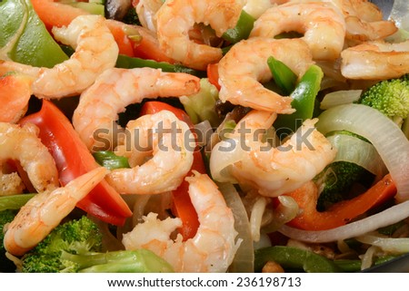 Close up shot of shrimp stir fry with vegetables