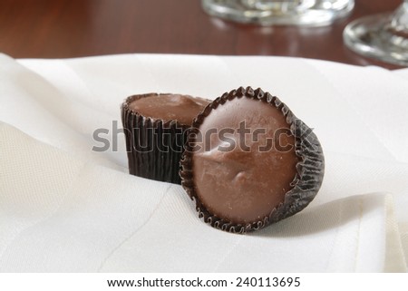 Small peanut butter cups on a white napkin