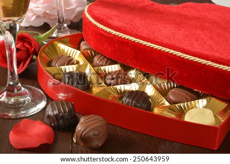 A velvet box of gourmet Valentines Day chocolates with champagne