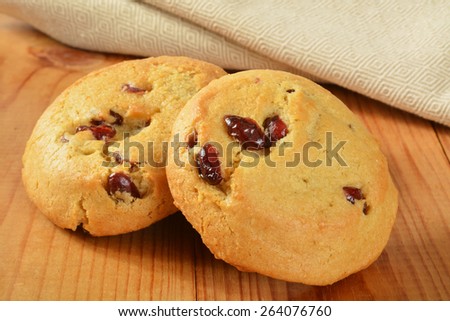 Gourmet soft cranberry orange cookies on a rustic wooden table