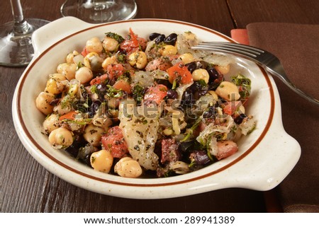 Savory Middle Eastern salad with chickpeas, black beans and tomatoes