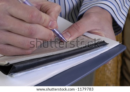 a man writes a check