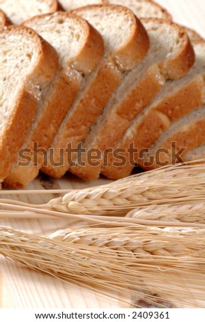 Golden wheat and a loaf of whole wheat bread