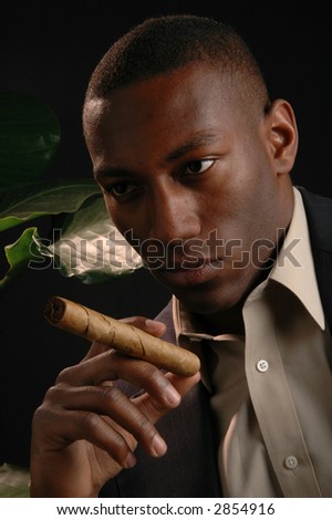 A handsome man in a cigar bar