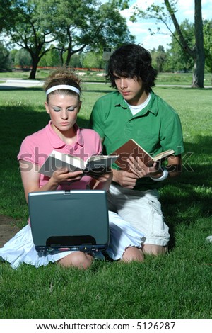 A couple studying in the park