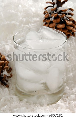 An ice cold drink in a bed of freshly fallen snow flakes