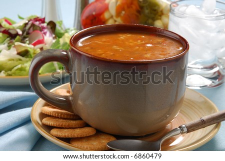 A hot meal of chicken gumbo soup and salad