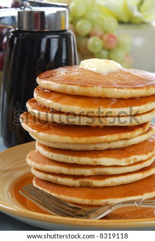 Блины, блинчики... Stock-photo-a-tall-stack-of-pancakes-covered-in-syrup-and-butter-8319118