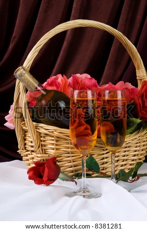 A Valentine\'s day basket filled with roses and wine