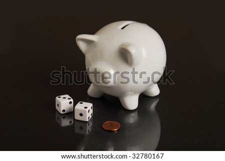 A piggy bank, a penny and dice representing a last chance