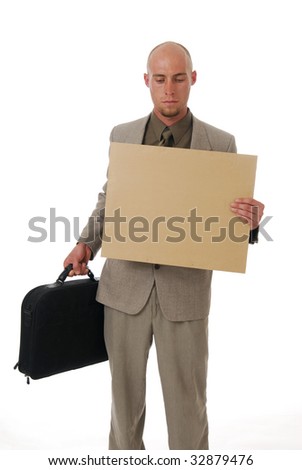An out of work IT professional with a blank sign, and a laptop computer in a case