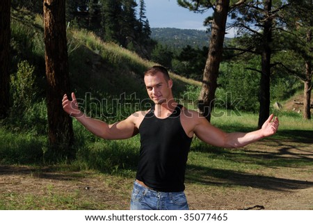 A man holding his arms out greeting the great outdoors