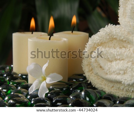 Three votive spa candles in a tropical, exotic setting