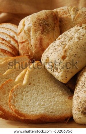 Close up photo of fresh artisan breads on a cutting board