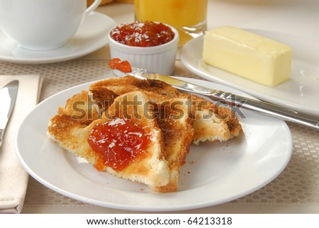 Buttered toast with strawberry apricot jam