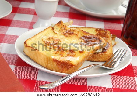 A plate of buttered french toast