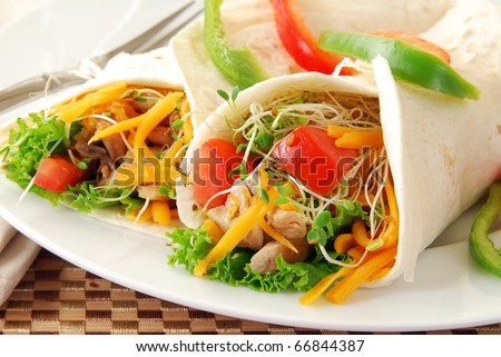 Chicken and vegetables wrapped in tortilla shells