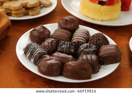 A plate of gourmet chocolates with other treats