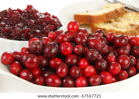 Fresh cranberries, cranberry sauce and bread
