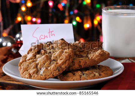 A plate of chocolate chip cookies and a glass of milk left out for Santa Claus on Christmas Eve