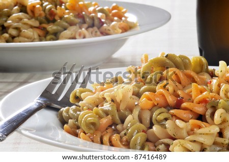 Close up of a bowl of pasta salad with vegetable noodles
