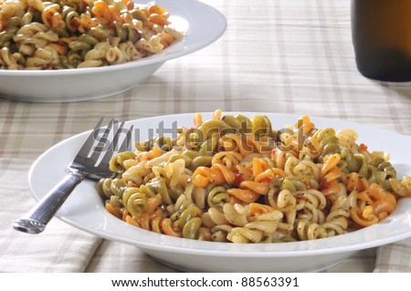 a bowl of pasta salad with vegetable noodles
