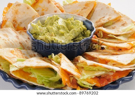 Closeup photo of quesadillas with guacamole