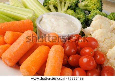 A vegetable platter with blue cheese dressing