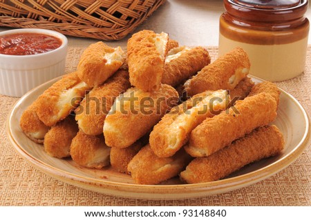 A plate of fried cheese mozzarella cheese sticks