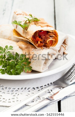 [Obrazek: stock-photo-mexican-burritos-on-a-plate-162555446.jpg]
