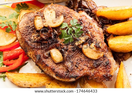 Fried pork chop with mushrooms and chips