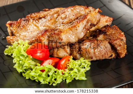 Grilled steaks and vegetables on a plate