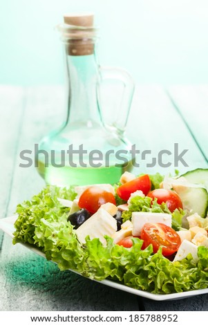 Fresh vegetable salad with cheese and olives