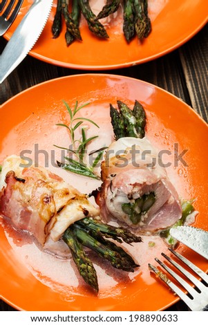 Baked fresh asparagus wrapped in chicken and bacon