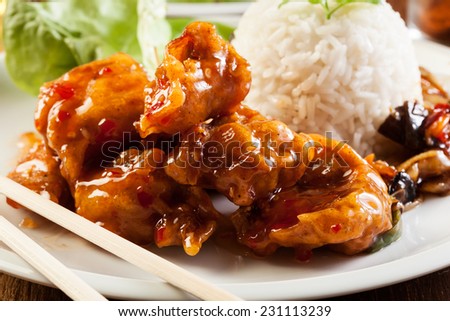 Fried chicken pieces in batter with sweet and sour sauce