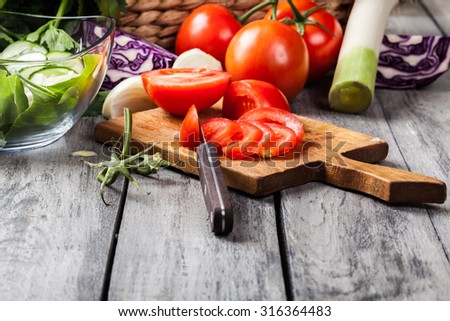 Chopped vegetables: tomatoes on cutting board. Selective focus
