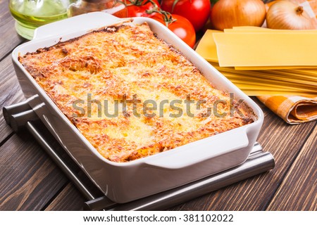 Hot tasty lasagna in ceramic casserole dish