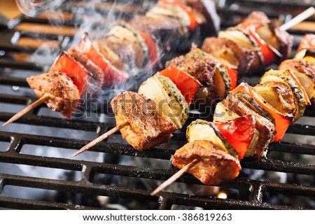 Grilling shashlik on barbecue grill. Selective focus