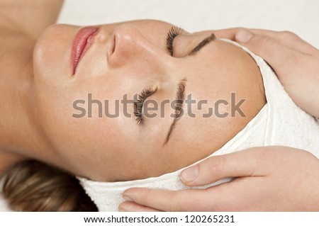 woman enjoying facial, day spa image