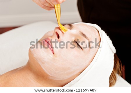 woman relaxing during a facial treatment