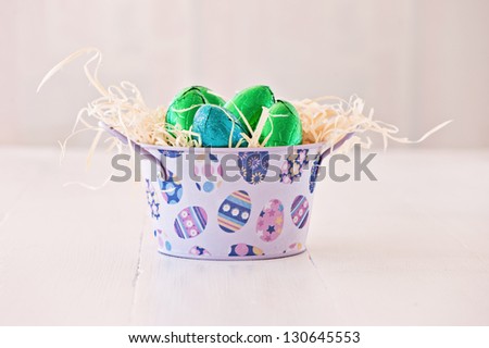 foiled easter eggs in a tin with straw, vintage feel
