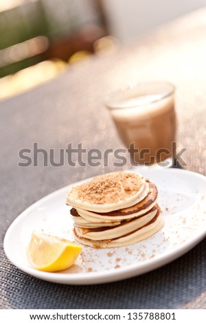sunday breakfast at my house, it\'s a struggle to even get a few photos shot! yum mini pancakes with brown sugar and lemon