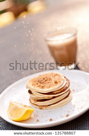 sunday breakfast at my house, it\'s a struggle to even get a few photos shot! yum mini pancakes with brown sugar and lemon, and coffee