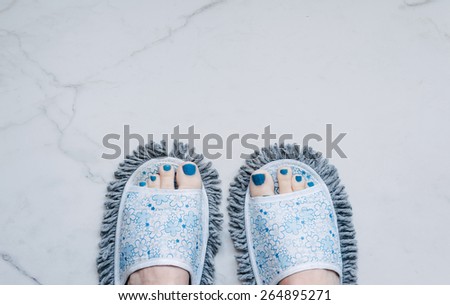 feet in quirky slippers that are also a mop, silly stuff you buy online
