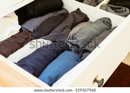 organised wardrobe, rolling shirts is the trick