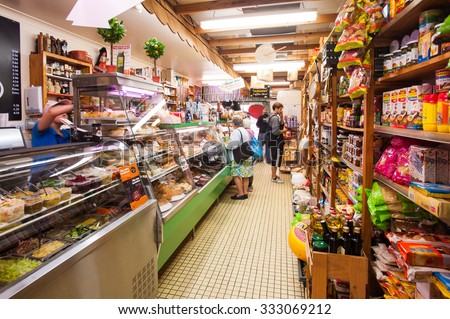 BRISBANE, AUSTRALIA,  CIRCA JUNE 2012: customers shopping in a local deli in Brisbane. Family run small businesses are being wooed by both major political parties in the lead up to the Federal Election.