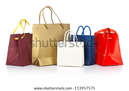 Assorted  shopping bags including red, gold, blue  on a white background