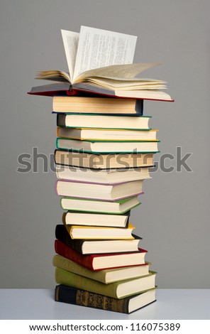 Pile of books on grey background