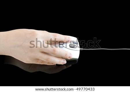 pc mouse in  hand on the black