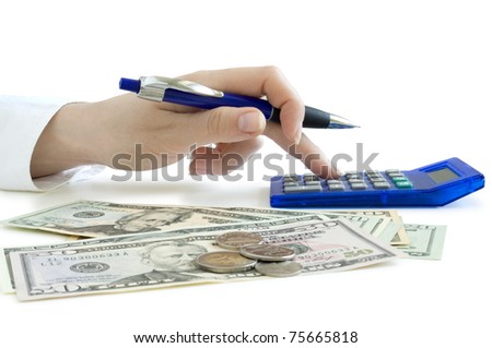 hand with pen counting on the calculator and dollars on the table isolated on white